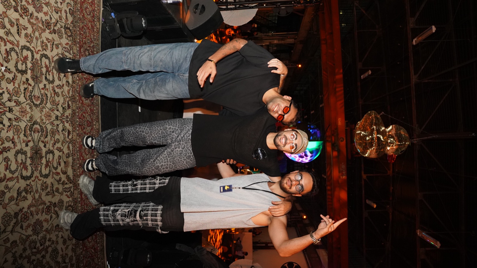 The three Quack Circle founders under the gold disco duck at Solstice Sessions