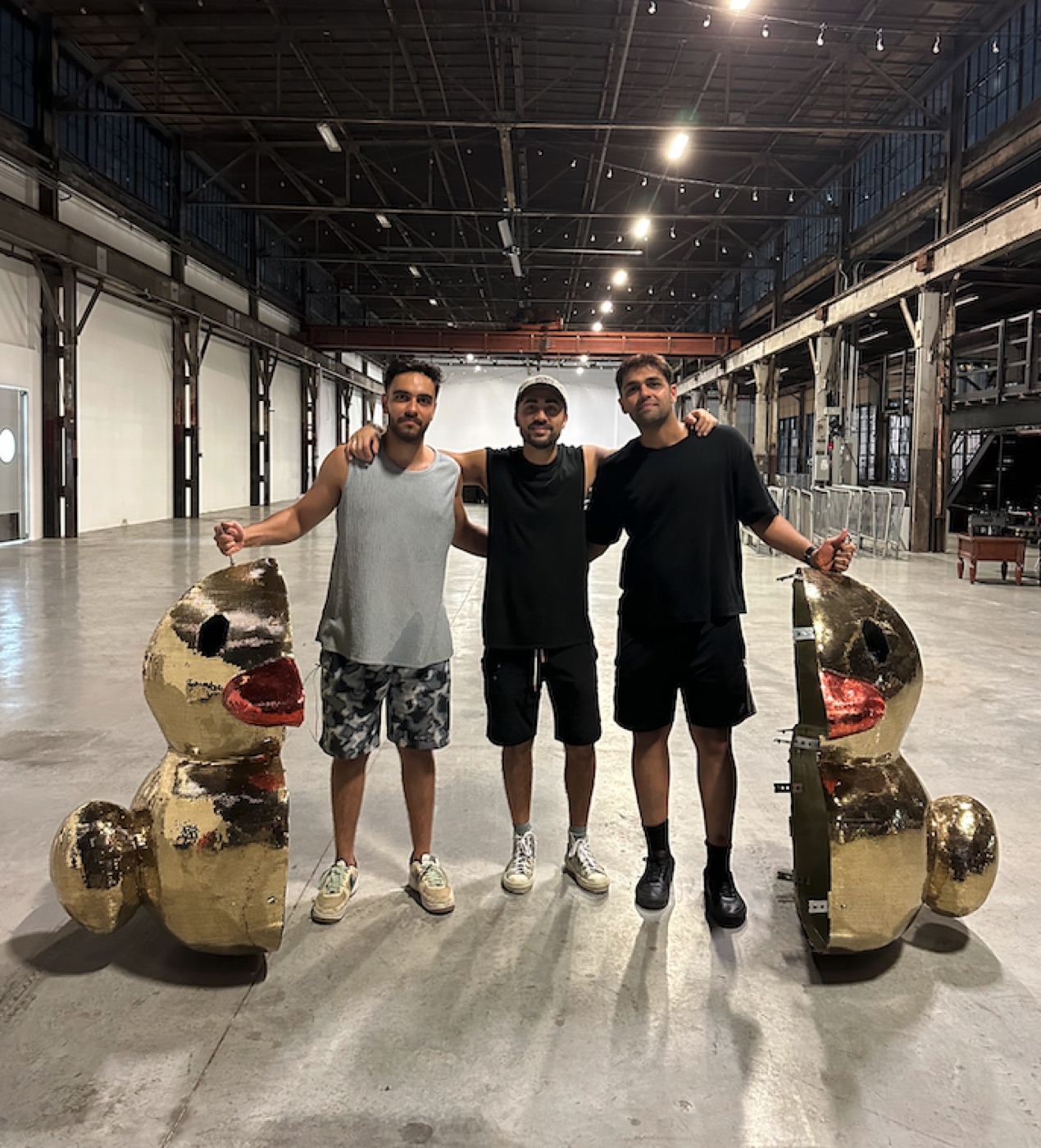 The Quack Circle founders with the gold duck sculptures in the hall at Iron Works
